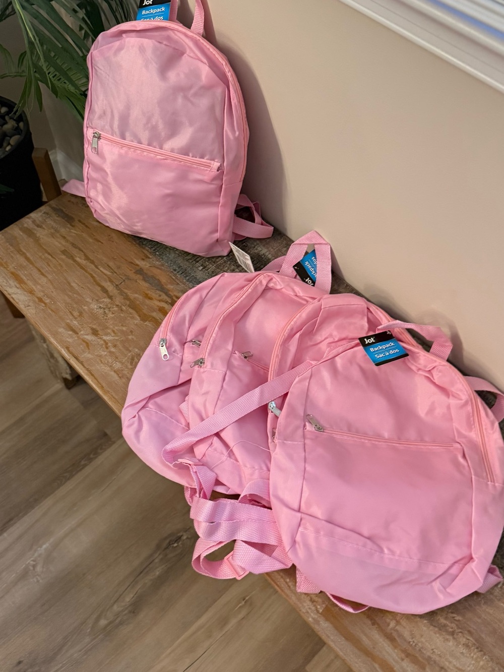 Bulk set of 5 New Light pink small nylon backpacks. Adjustable straps.